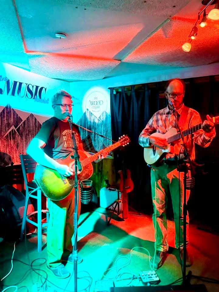 Two Wild Mountain Thyme guitarists playing at The Wood Cellar